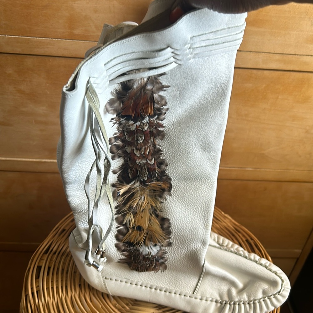 White leather and feather moccasin boots